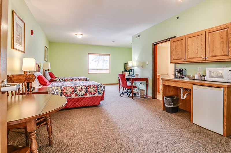 Private suite with kitchenette and living space at Cornerstone Residence of Oklee